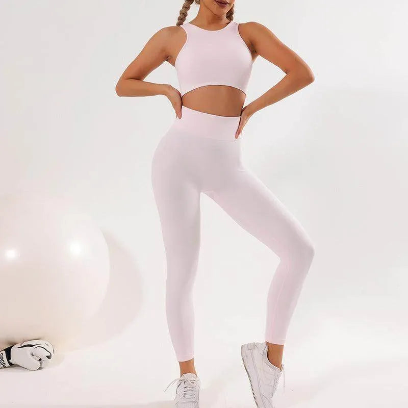 Woman wearing a white athletic outfit on a light gray background