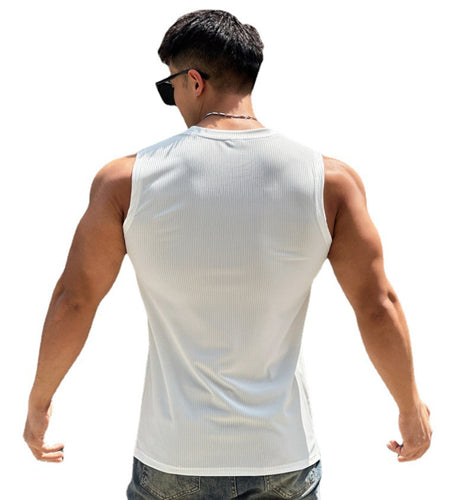 Man wearing a white tank top on a white background