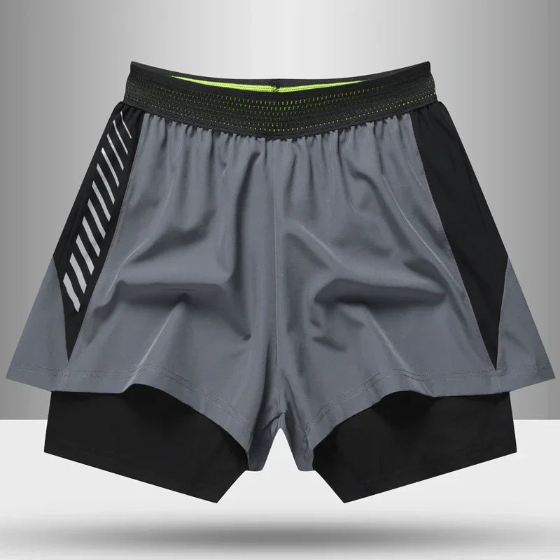 Gray and black athletic shorts on a gray background