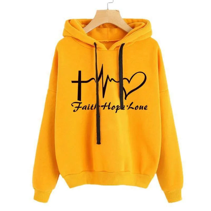Yellow hoodie with 'Faith Hope Love' text and symbols on a white background