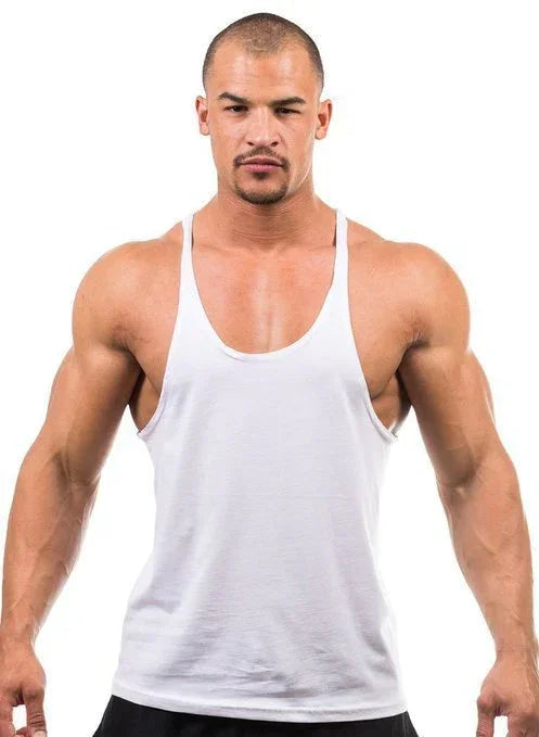 Man wearing a white tank top against a white background