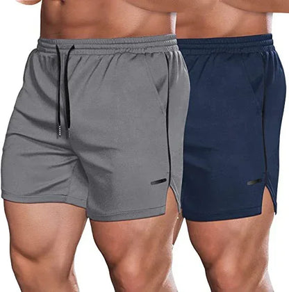Two pairs of shorts, one gray and one navy, on a person against a white background.