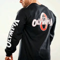 Black long-sleeve shirt with 'Olympia' logo on the back, worn by a person.