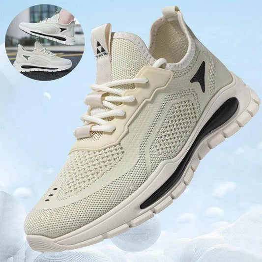 Beige running shoe with black accents on a light blue background