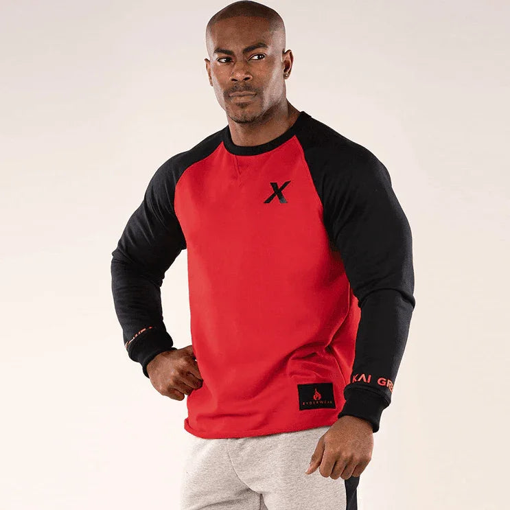 Man wearing a red and black long-sleeve shirt with a logo on a white background