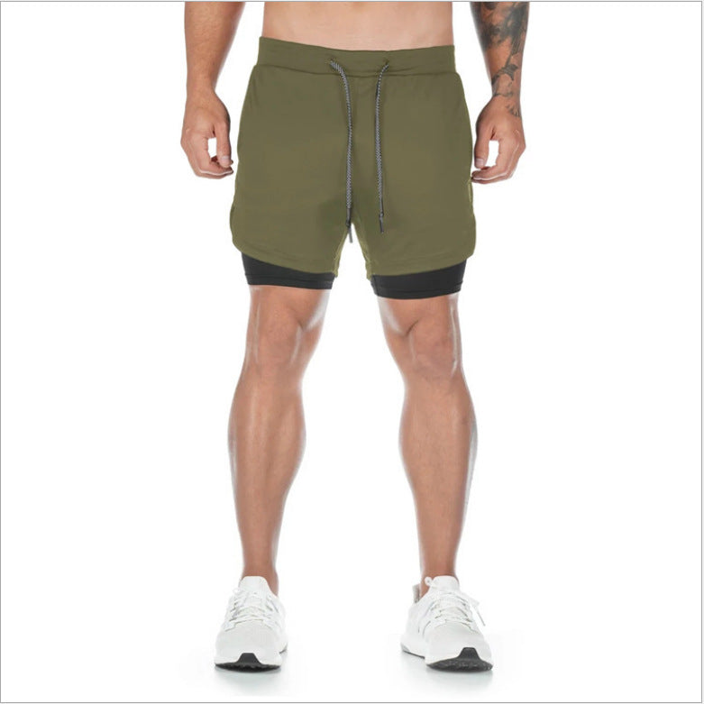 Green athletic shorts with black accents worn by a person on a white background