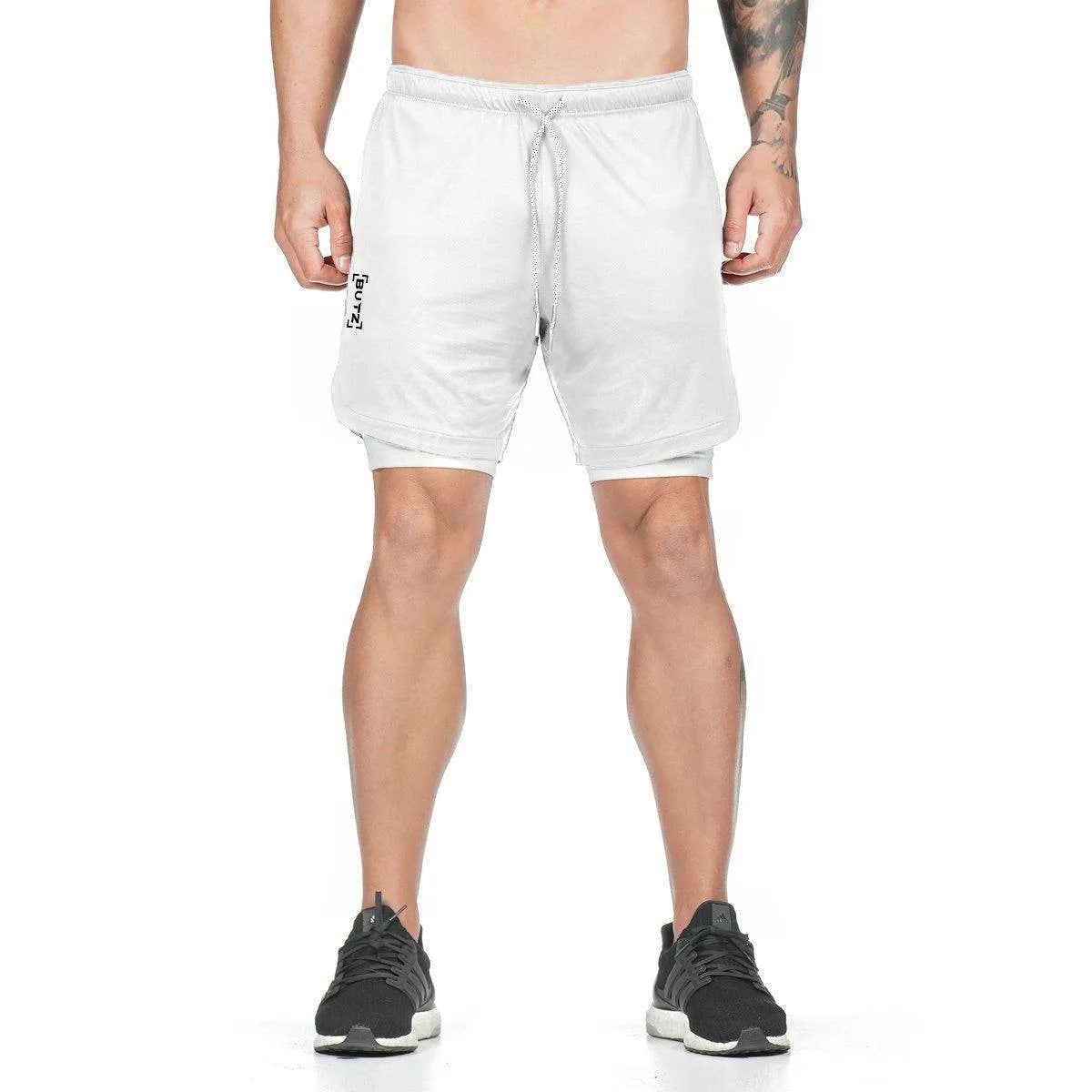 Person wearing white shorts on a white background
