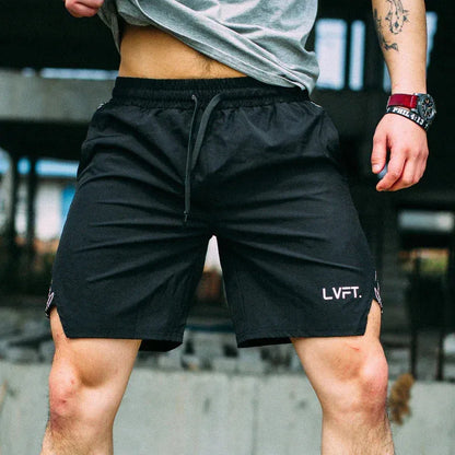 Person wearing black shorts with 'LVFT' branding in an urban setting