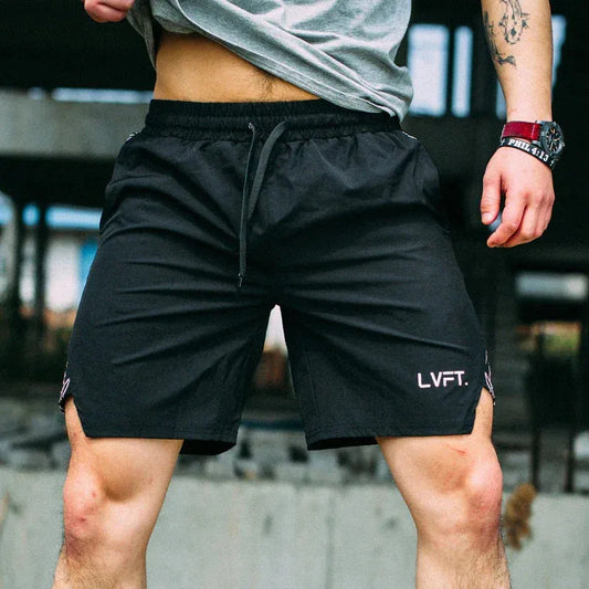Person wearing black shorts with 'LVFT' branding in an urban setting