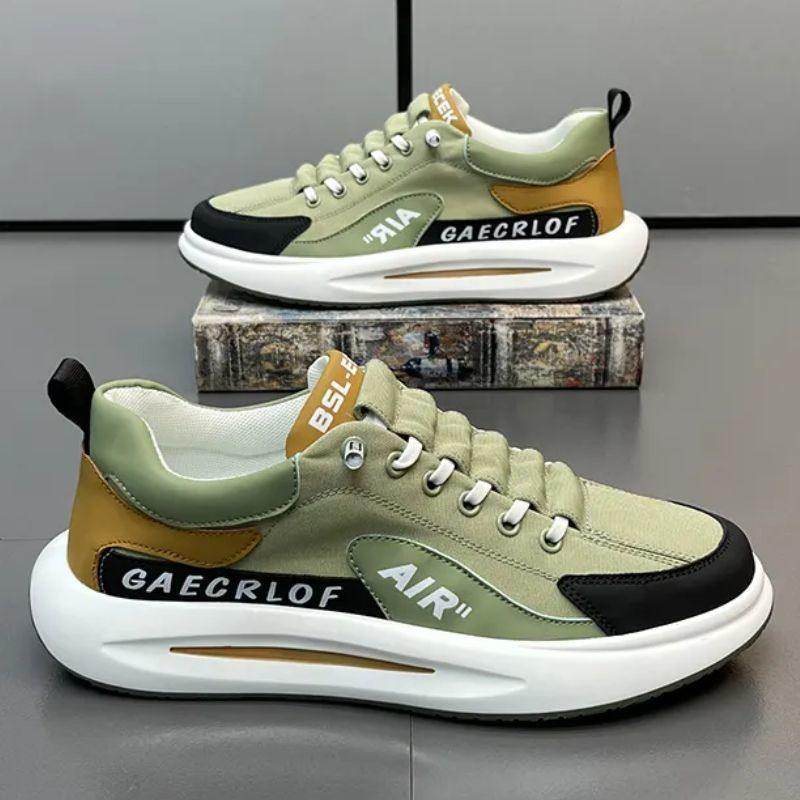 Green and brown sneakers with 'GAECROLOF' branding on a gray surface.