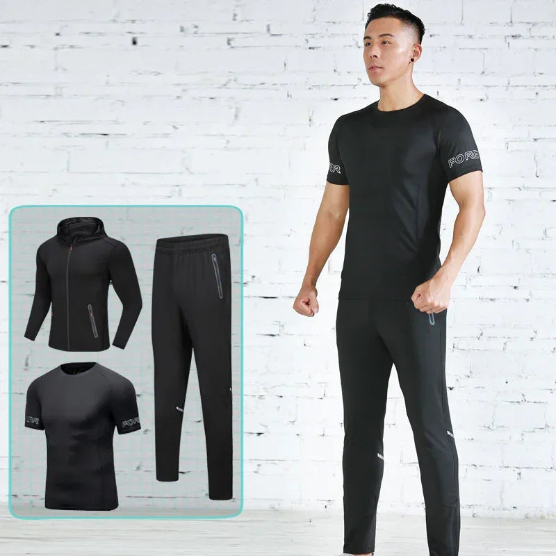 Man wearing a black athletic outfit with a white brick wall background