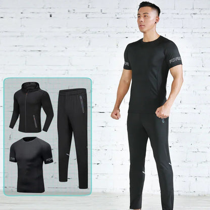 Man wearing a black athletic outfit with a white brick wall background