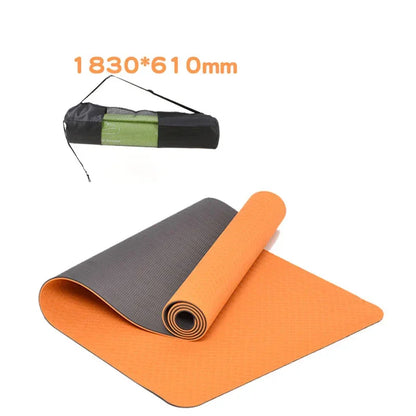 Orange and gray yoga mat with carrying strap on a white background