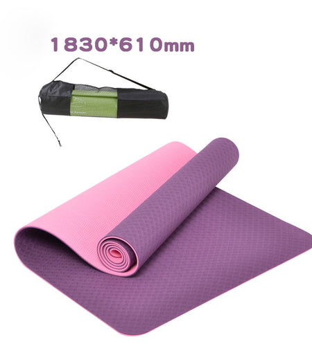 Purple and pink yoga mat with carrying strap on a white background