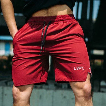 Red shorts with a brand logo worn by a person outdoors.