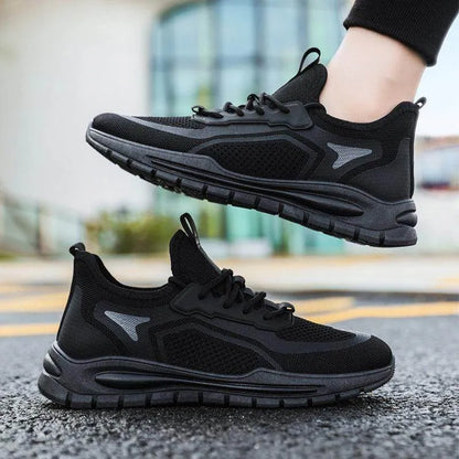 Black athletic shoes on a blurred street background