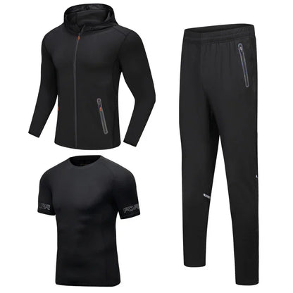 Black athletic outfit with jacket, pants, and t-shirt on a white background