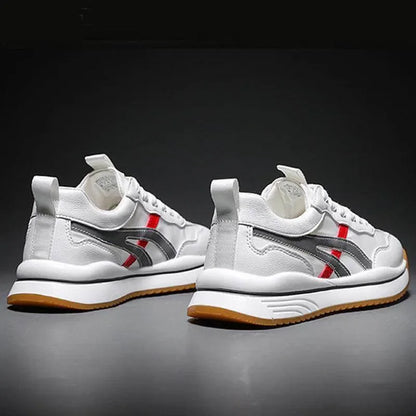 White sneakers with red and gray accents on a dark background