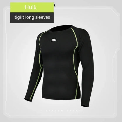 Black long-sleeve athletic shirt with green accents on a gray background