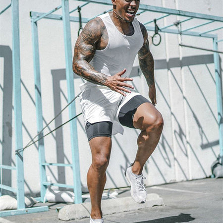 Man in athletic wear running outdoors on a sunny day