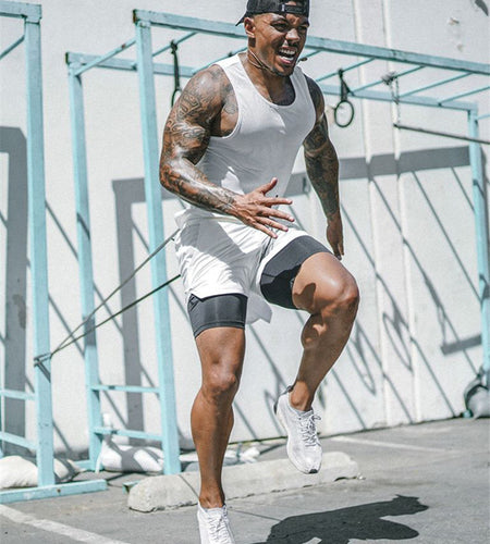 Man in athletic wear running outdoors on a sunny day