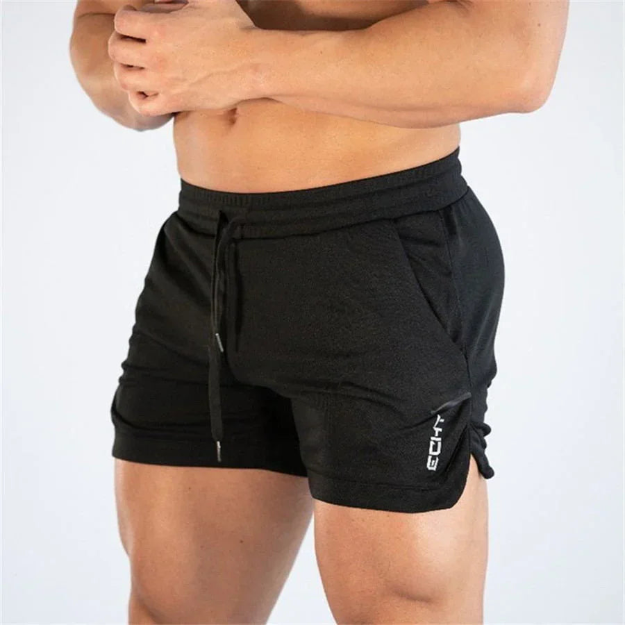 Black shorts with drawstring and zipper pocket on a white background