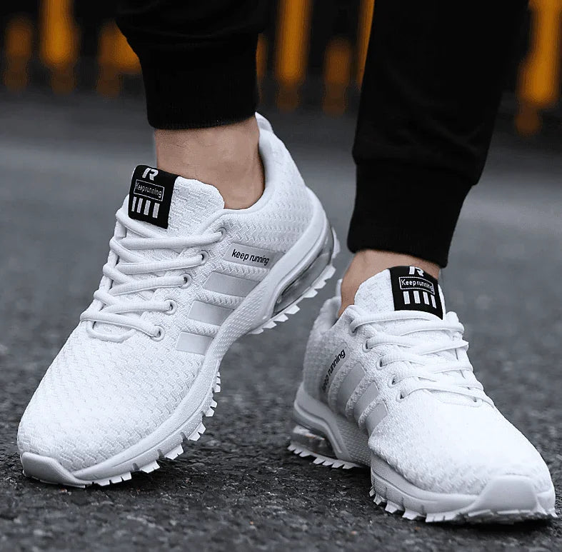 White sneakers with brand logo on a blurred background