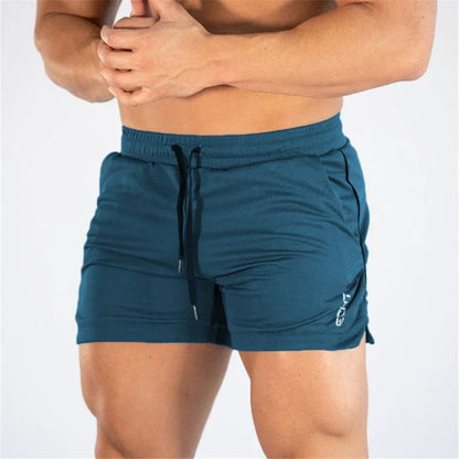 Teal shorts worn by a person on a white background