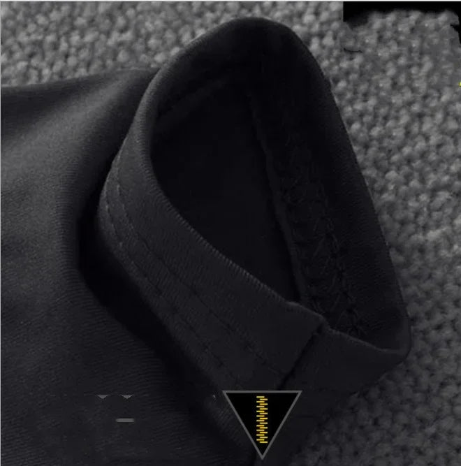 Close-up of a black fabric texture with a brand logo at the bottom.