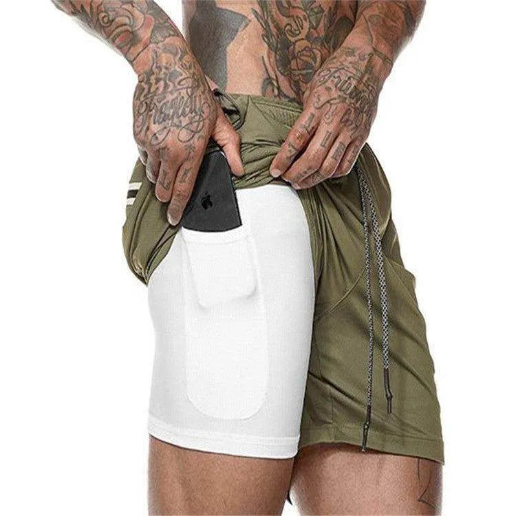 Person wearing a green and white athletic outfit with tattoos on arms.