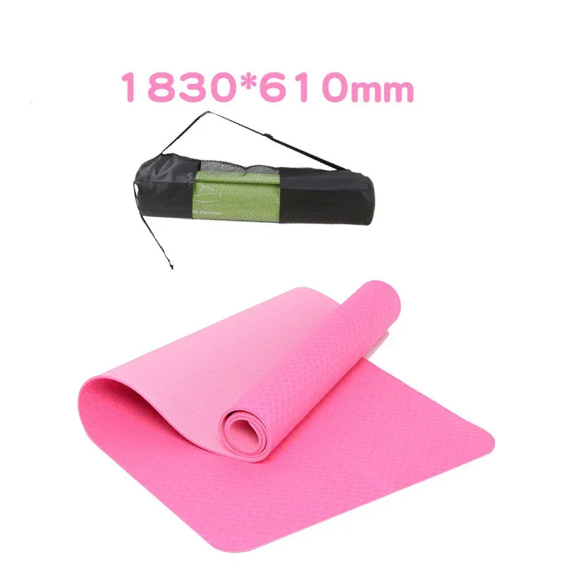 Pink yoga mat with carrying strap on a white background, dimensions displayed.