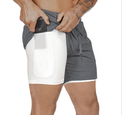 Gray and white athletic shorts with a pocket on a white background