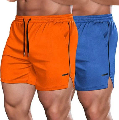 Two pairs of shorts, one orange and one blue, on a plain background.
