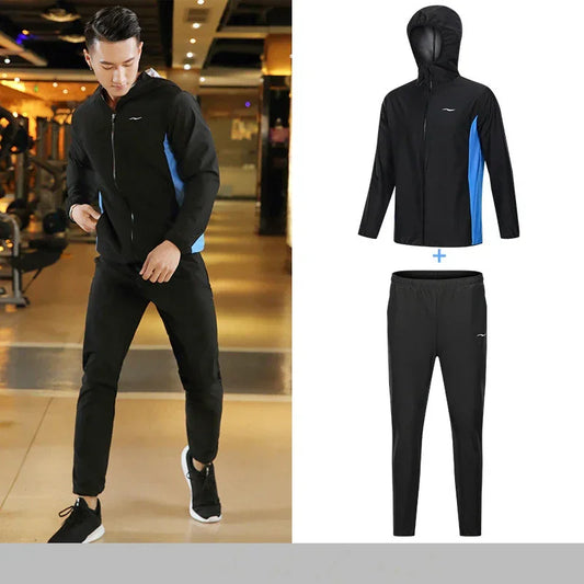 Person wearing a black tracksuit with blue accents in a gym setting, with an inset showing the tracksuit components.