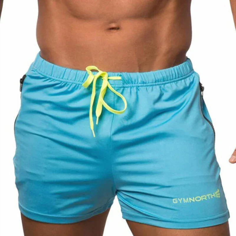 Blue shorts with yellow drawstring and 'GYMNORTH' branding on a white background