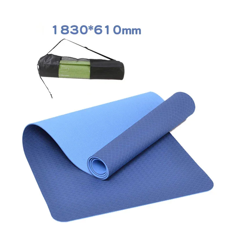 Blue yoga mat with carrying strap on a white background