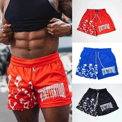 Red shorts with white graphics and text, displayed with a person wearing them.