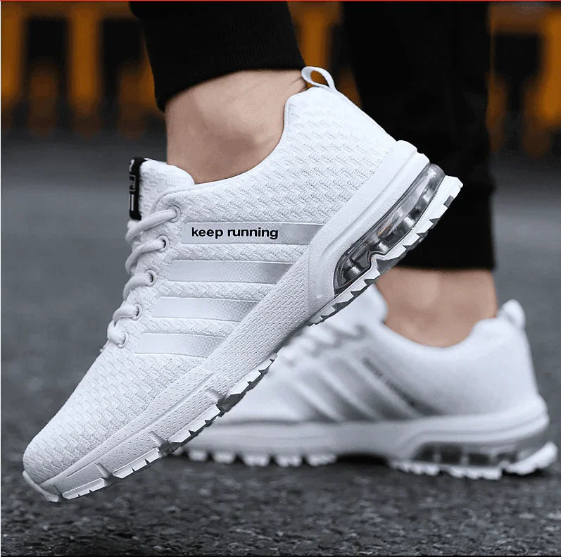 White running shoes with 'keep running' text on a blurred background