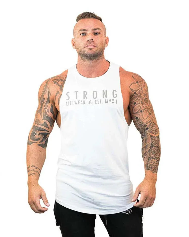 Man wearing a white tank top with 'STRONG' branding on a white background