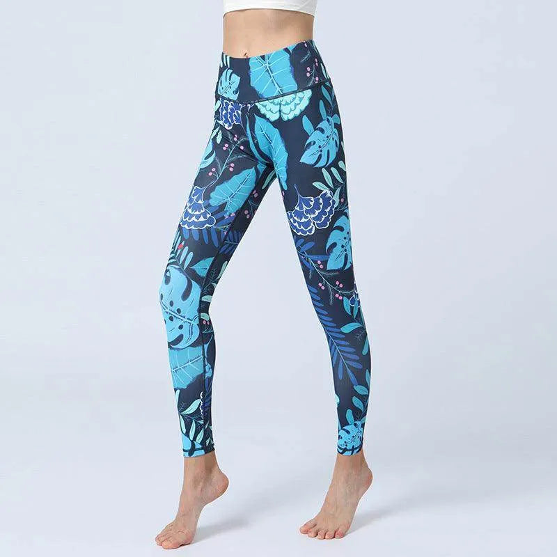 Leggings with blue and green plant pattern on a white background