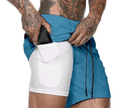 Person wearing a blue and white athletic outfit with tattoos on arms and legs.