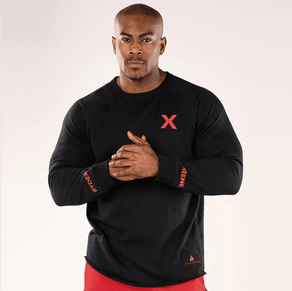 Man wearing a black long-sleeve shirt with red accents on a white background