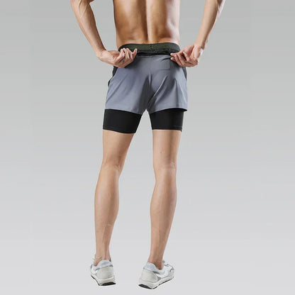 Person wearing a two-tone athletic shorts on a plain background