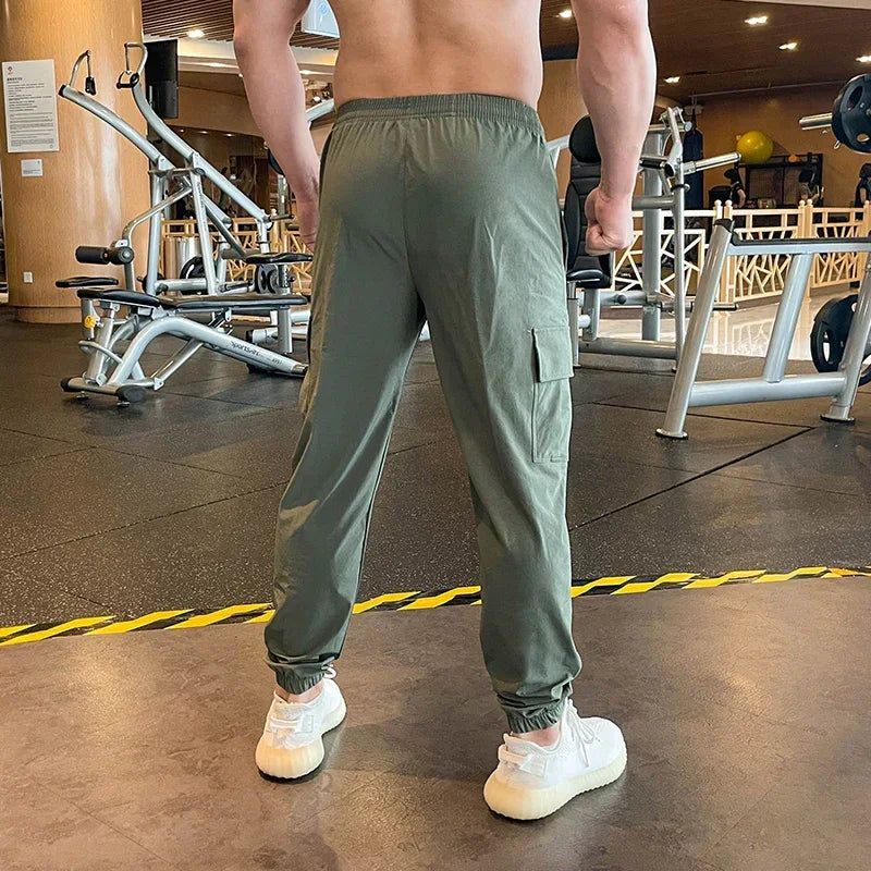 Person wearing green cargo pants in a gym setting