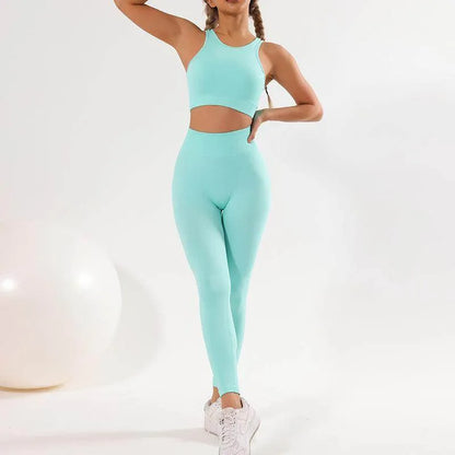 Person wearing a mint green athletic outfit on a white background