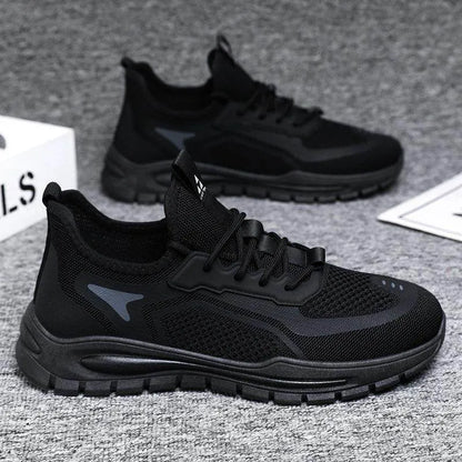 Black athletic shoes on a gray textured surface