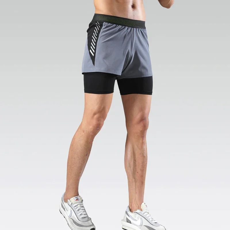 Person wearing a two-tone running shorts with a plain background