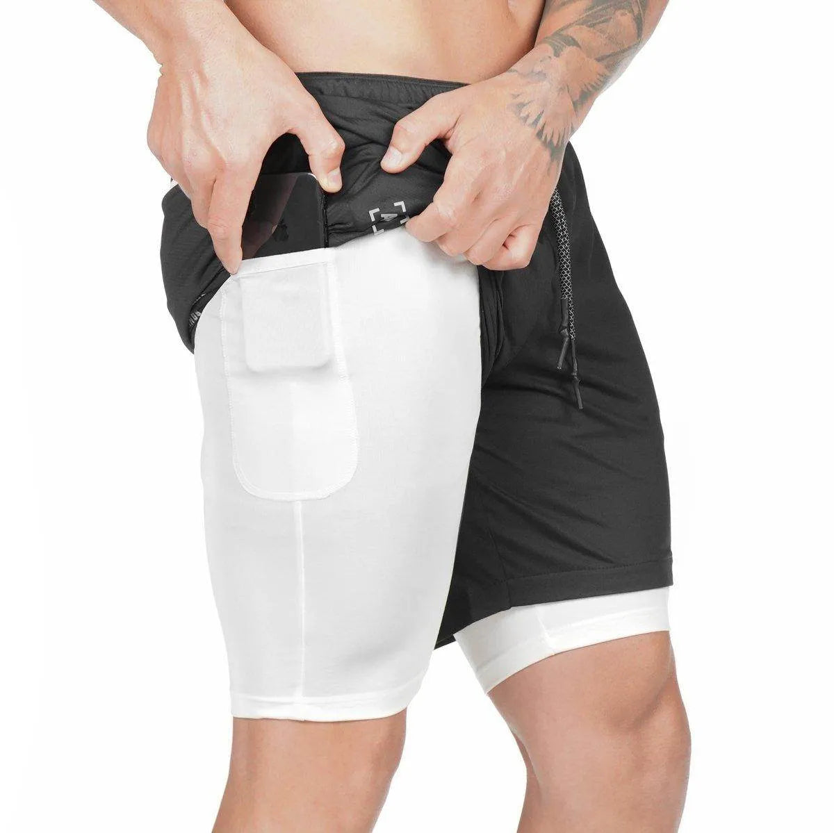 Person wearing a black and white athletic outfit with a focus on the shorts.