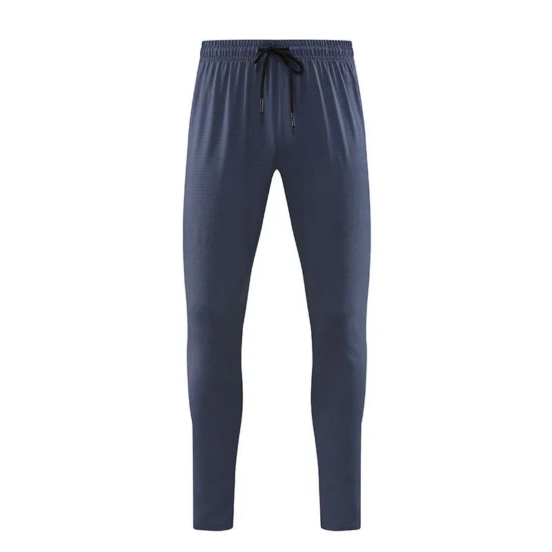 Navy blue jogger pants on a white background