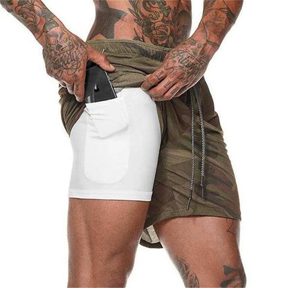Person wearing a green and brown patterned wrap over a white garment on a white background